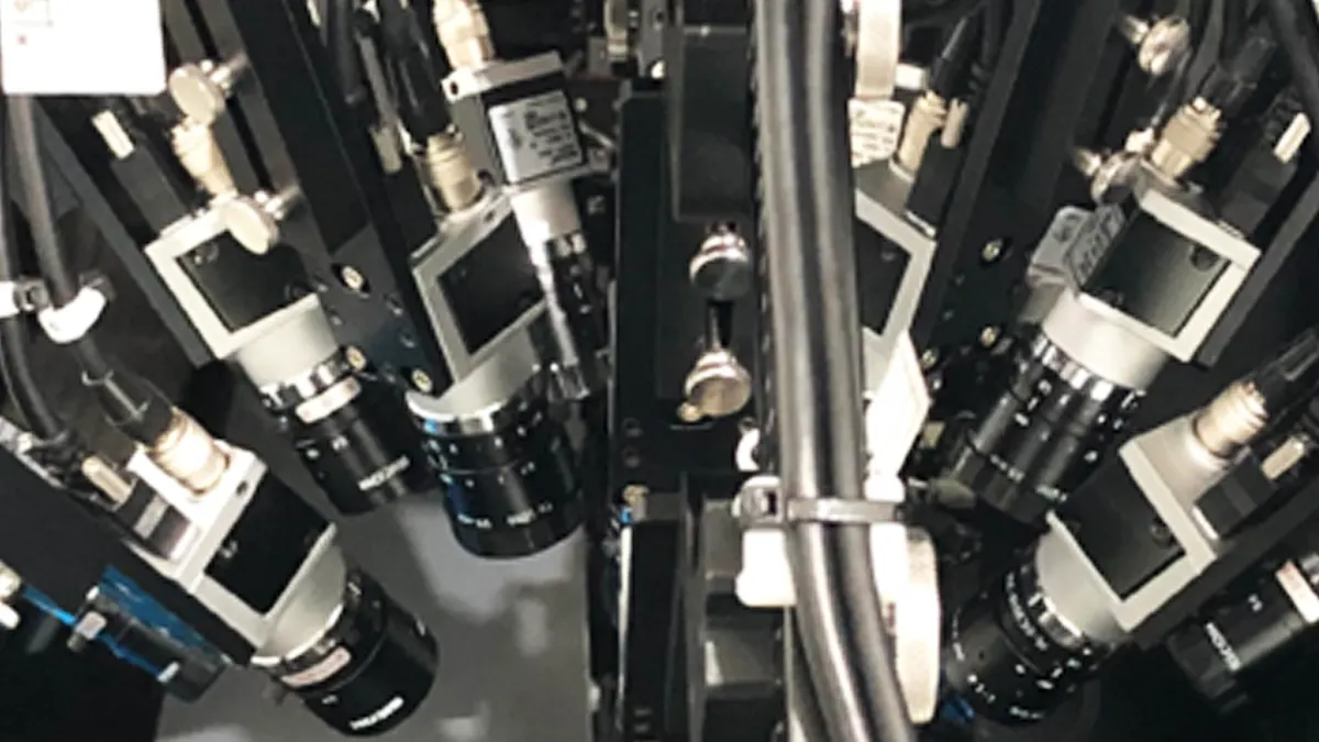 Multiple cameras inspecting multiple positions of a lens