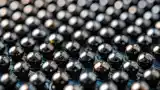 Highly reflective solder balls on a dark PCB panel: an example of challenging contrast conditions addressed by HDR imaging.